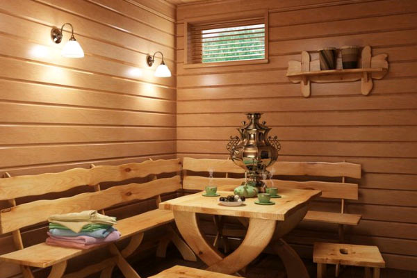 Предбанник с красивыми светильниками и мебелью ручной работы