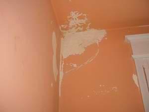 photo water damage removed from a wall and ceiling