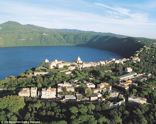 Researchers say Colli Albani, a 15-kilometer (9-mile) semicircle of hills outside Rome (pictured), is starting a new eruptive cycle and could potentially erupt in 1,000 years from now. Shown in as aerial view of Castel Gandolfo, Lake Albano and the Alban Hills in the background.
