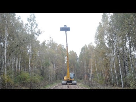 Очистка русла канавы длинноруким экскаватором. Long Reach Excavator Dredging Canal.