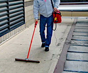 Photo 5 showign workman conducting the hgh voltage test on a roof